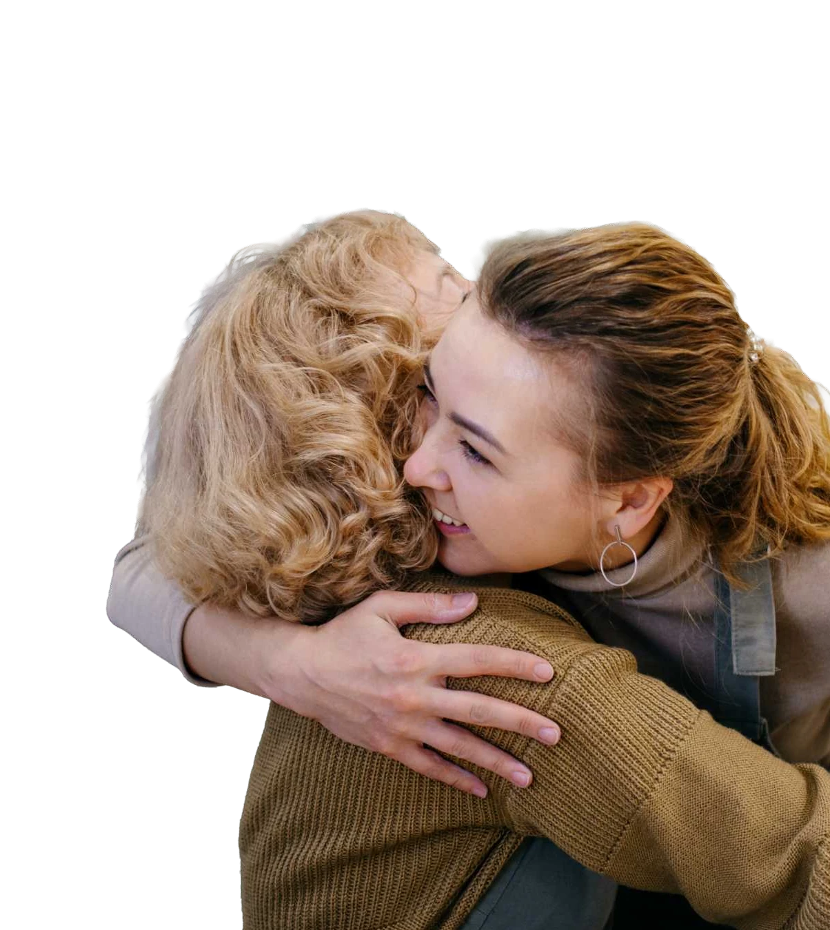 Two women embracing, one holding a bouquet of flowers